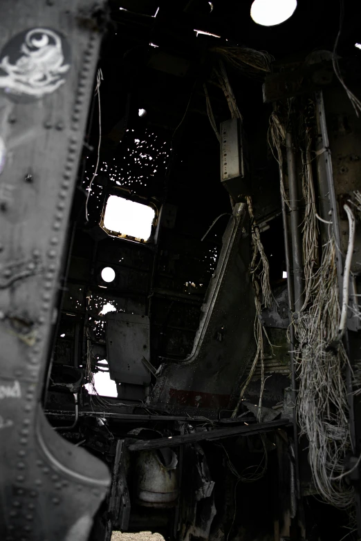 a close up of a train inside of a building, battle-damaged, black helicopters, photographed for reuters, color”