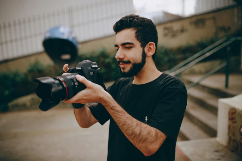 a man taking a picture with a camera, a picture, by Ismail Acar, pexels contest winner, photorealism, young spanish man, low quality footage, avatar image, half - length photo