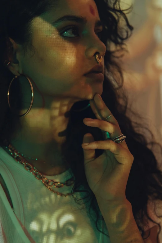 a woman holding a cell phone to her ear, inspired by Elsa Bleda, smoking a magical bong, provocative indian, digital still, wearing two metallic rings