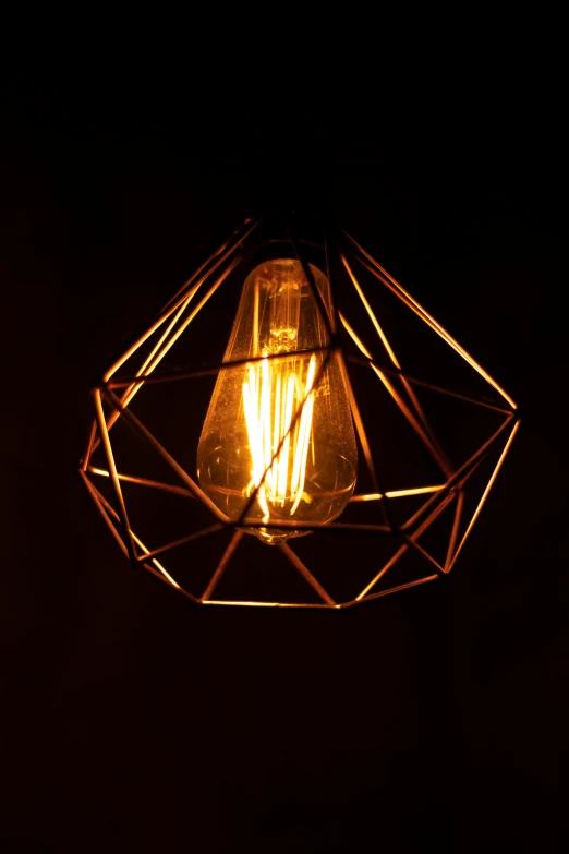 a light that is on in the dark, by Bertram Brooker, pexels, light and space, copper elements, retro stylised, faceted, electricity