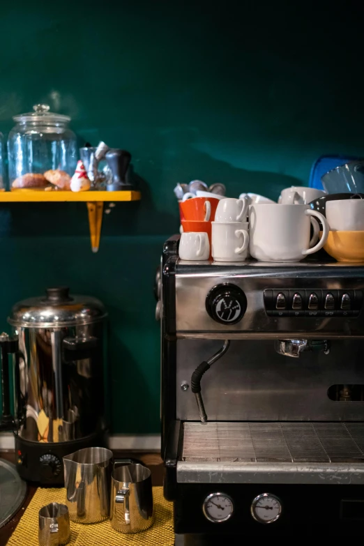 a stove top oven sitting in a kitchen next to a sink, a still life, small hipster coffee shop, intense colours, coffee cups, jar on a shelf