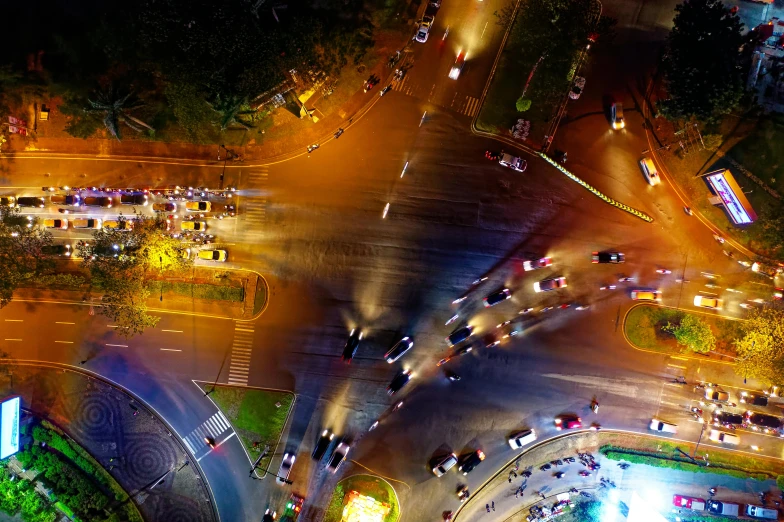 an aerial view of a busy intersection at night, pexels contest winner, square, fan favorite, chromatic, high quality image