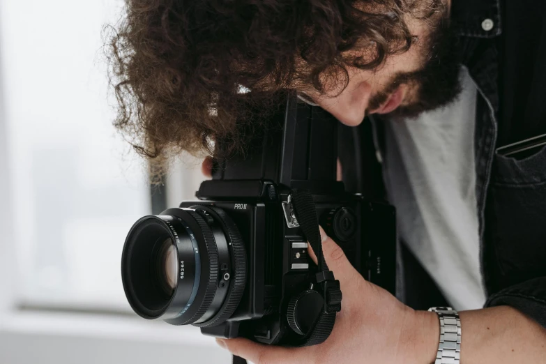 a man taking a picture with a camera, pexels contest winner, cinestill hasselblad 2 0 0 mm, close up shot from the side, home video footage, mid-shot of a hunky