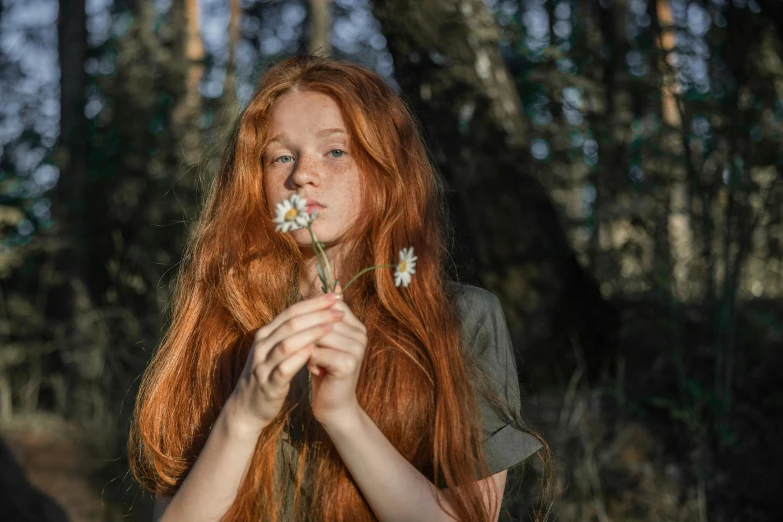 a woman with long red hair holding a flower, inspired by Elsa Bleda, pexels contest winner, pre-raphaelitism, teenager girl, cottagecore hippie, humanoid flora, natural skin