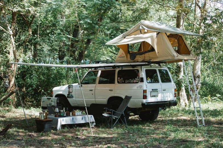 a van that has a tent on top of it, by Pamela Ascherson, unsplash, renaissance, in karuizawa, 2 5 6 x 2 5 6 pixels, hunting, backyard