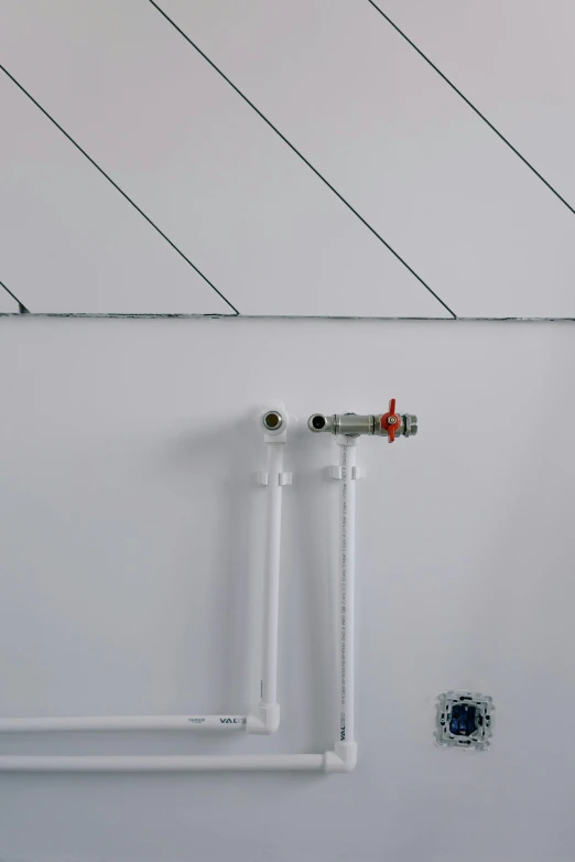 a white toilet sitting next to a toilet paper dispenser, by Tilo Baumgärtel, detail structure, radiator, peaks, passive house