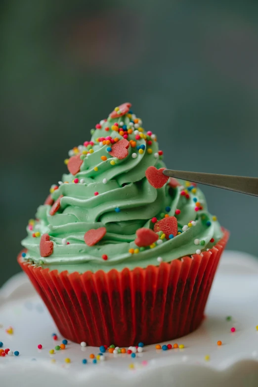 a cupcake with green frosting and sprinkles, pexels, red colored, christmas tree, 👅 👅, melbourne