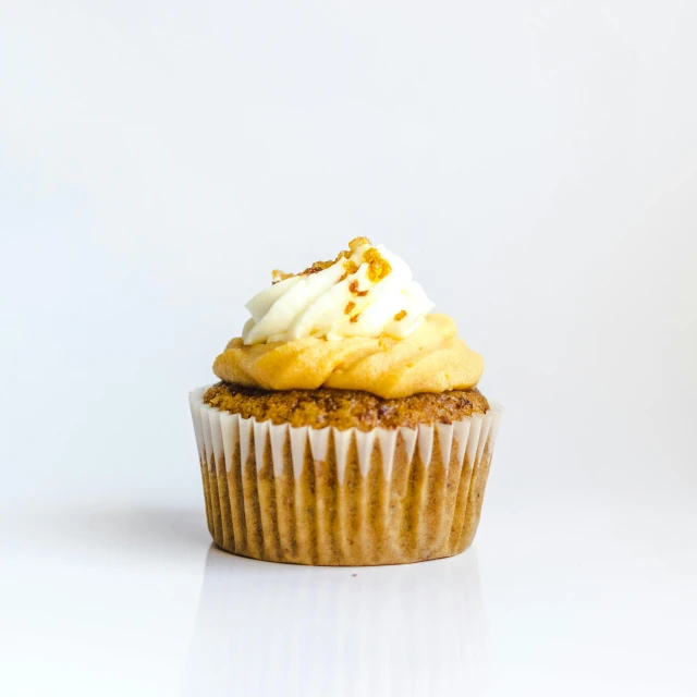 a cupcake sitting on top of a white table, product image, food, 5k, unedited