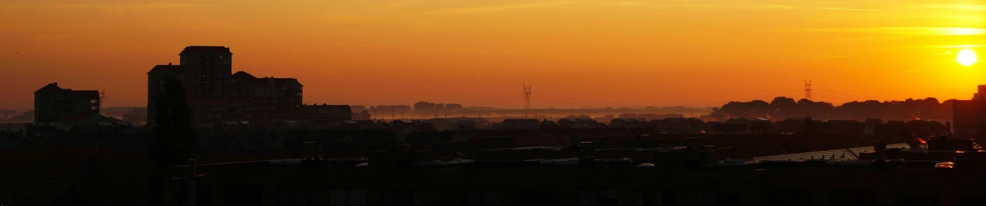 the sun is setting over the city skyline, a picture, by Gerard Houckgeest, happening, orange mist, helmond, seaview, telephone wires