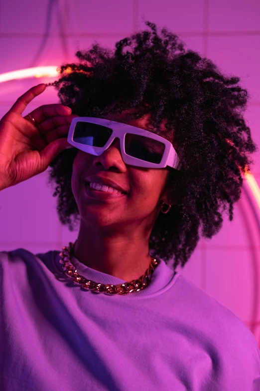 a woman holding a pair of glasses in front of her face, inspired by Michael Ray Charles, trending on pexels, afrofuturism, purple neon, vhs style, 3 dimensional, with afro