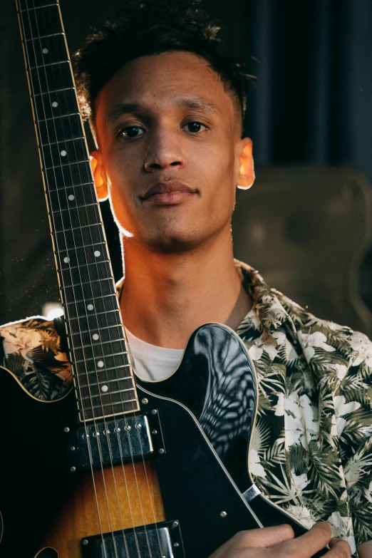 a close up of a person holding a guitar, an album cover, mixed race, looking to his side, non binary model, raffael