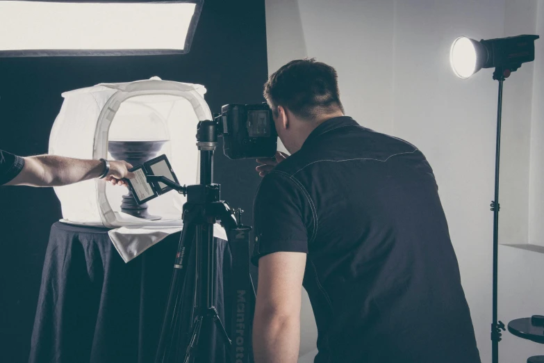 a man that is standing in front of a camera, advertising photography, product lighting, atmospheric photograph, photographic