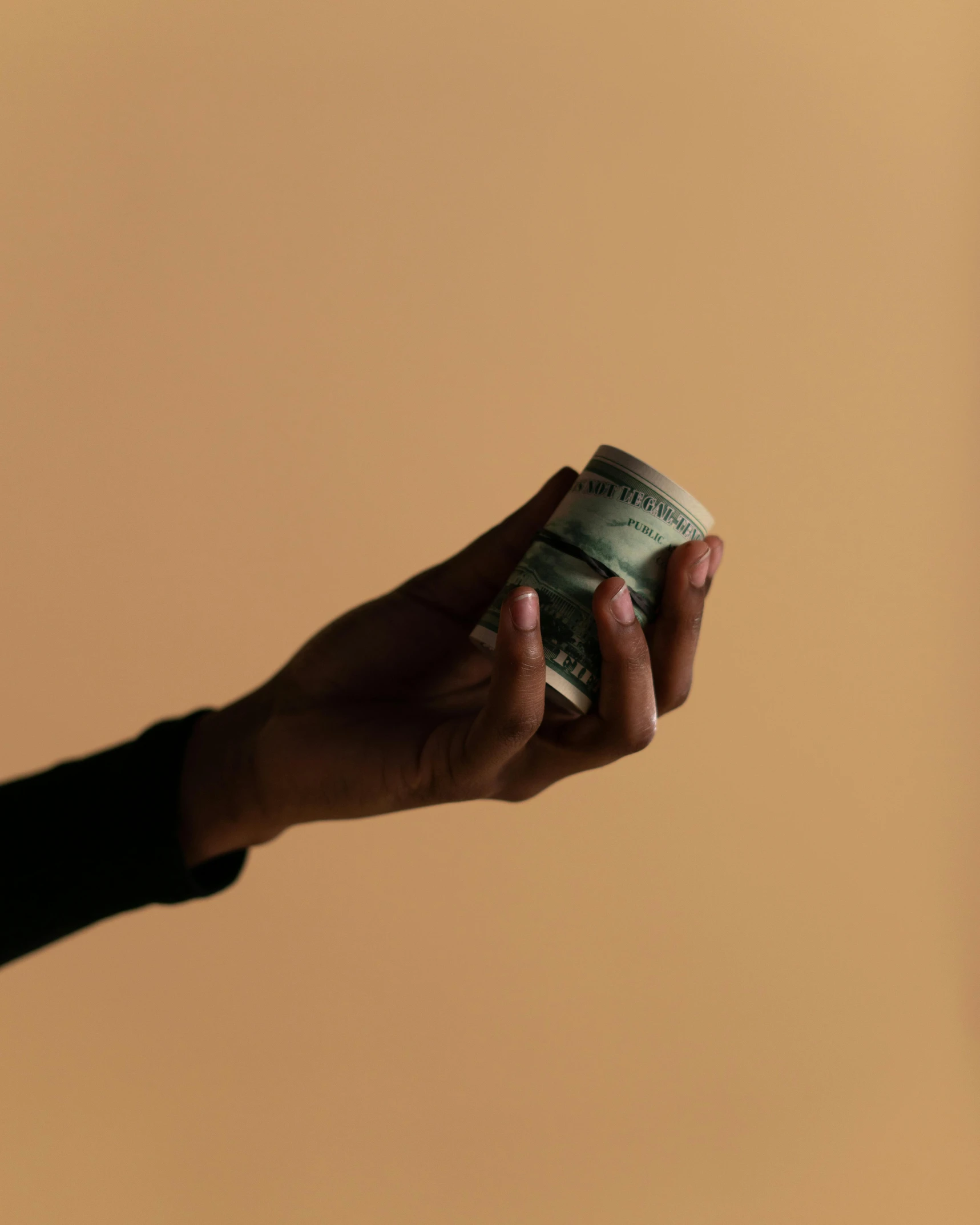 a person holding a stack of money in their hand, by Alison Geissler, pexels contest winner, hurufiyya, soft shade, lgbtq, 15081959 21121991 01012000 4k, an olive skinned