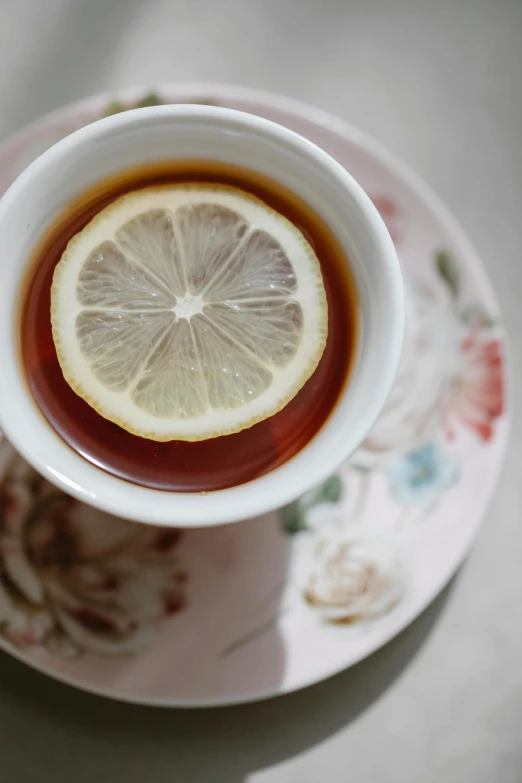 a cup of tea with a slice of lemon in it, a portrait, unsplash, renaissance, made of glazed, round-cropped, soft, paisley