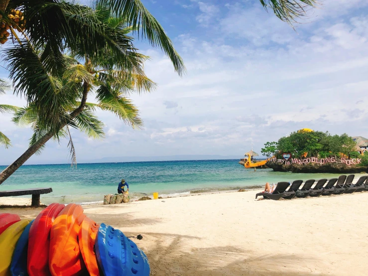 a bunch of surfboards sitting on top of a sandy beach, standing on a beach in boracay, avatar image, listing image, in a sun lounger