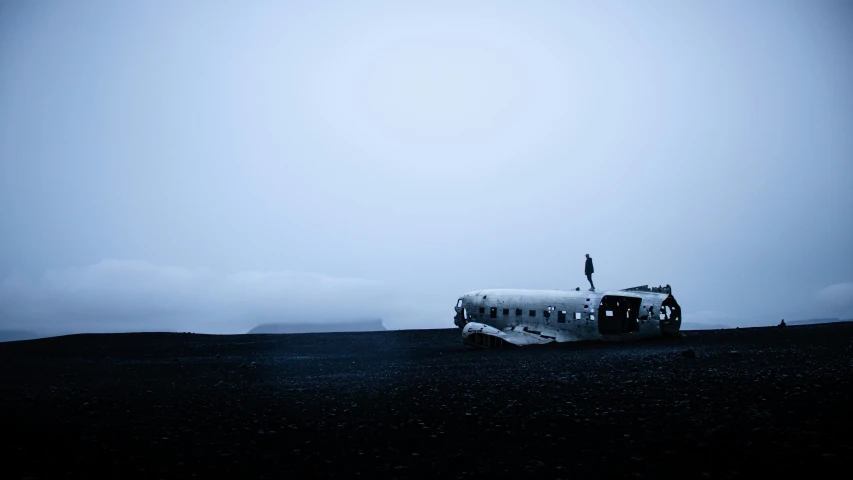 a bus that is sitting in the dirt, pexels contest winner, surrealism, plane, iceland photography, gray fog, injured