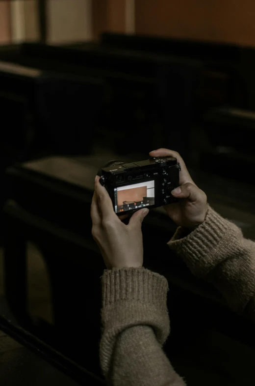 a person taking a picture with a camera, inspired by Elsa Bleda, dark academia aesthetic, sony a7, digital artist, college