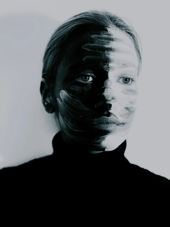 a black and white photo of a woman's face, a black and white photo, by Anna Füssli, facepaint, nina tryggvadottir, symmetrical face and body, black facemask
