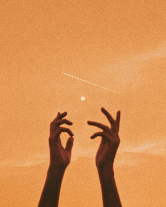 a person reaching up to the sky with their hands, an album cover, trending on pexels, aestheticism, pale orange colors, two pure moons, ☁🌪🌙👩🏾, reaching out to each other