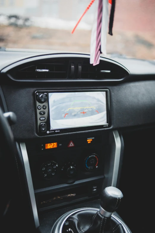 a close up of the dashboard of a car, a picture, by Sven Erixson, unsplash, square, monitor, map, standing sideways