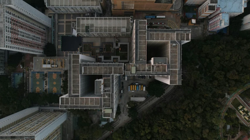 a bird's eye view of a city with tall buildings, unsplash contest winner, brutalism, front top side view, jin shan, medical research facility, 3/4 view from below