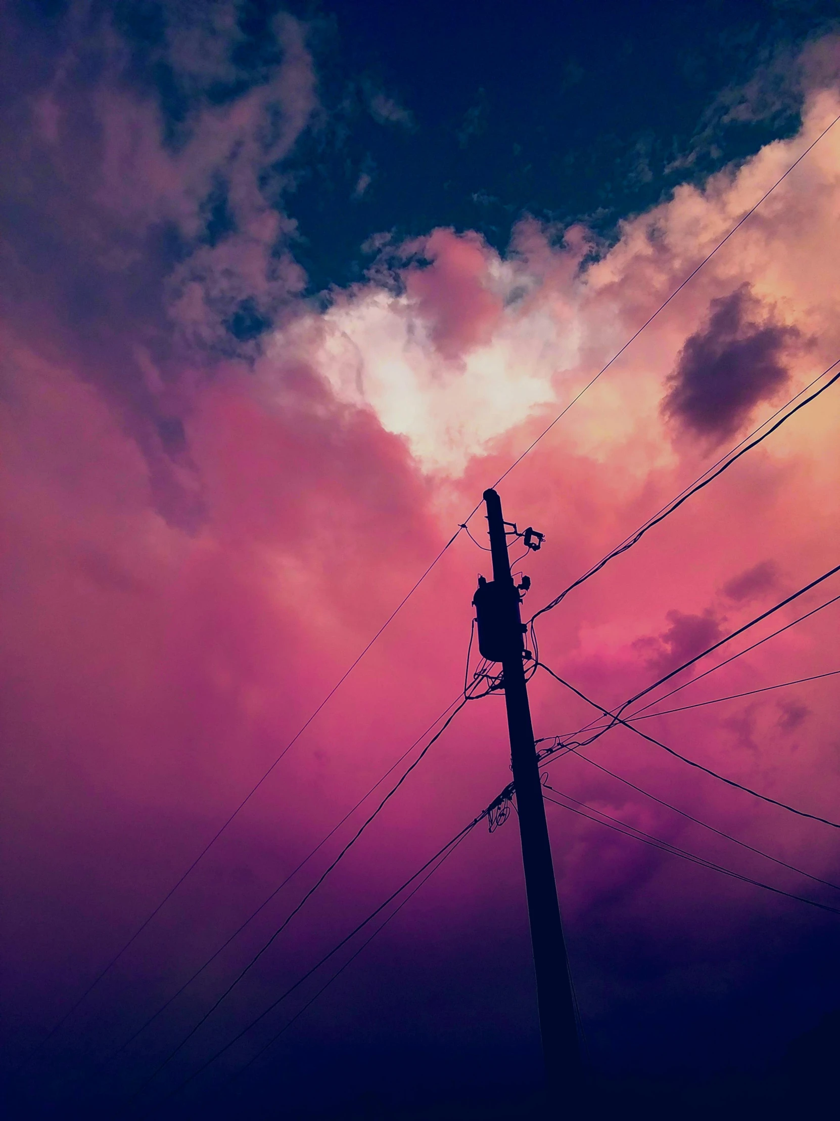 a telephone pole with a cloudy sky in the background, an album cover, inspired by Elsa Bleda, unsplash, aestheticism, ((pink)), ☁🌪🌙👩🏾, with beautiful colors, ) ominous vibes