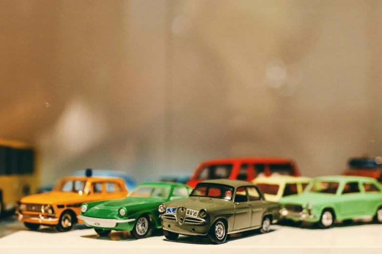 a group of toy cars sitting on top of a table, pexels contest winner, photorealism, instagram post, nostalgic 8k, brightly lit, medium - shot