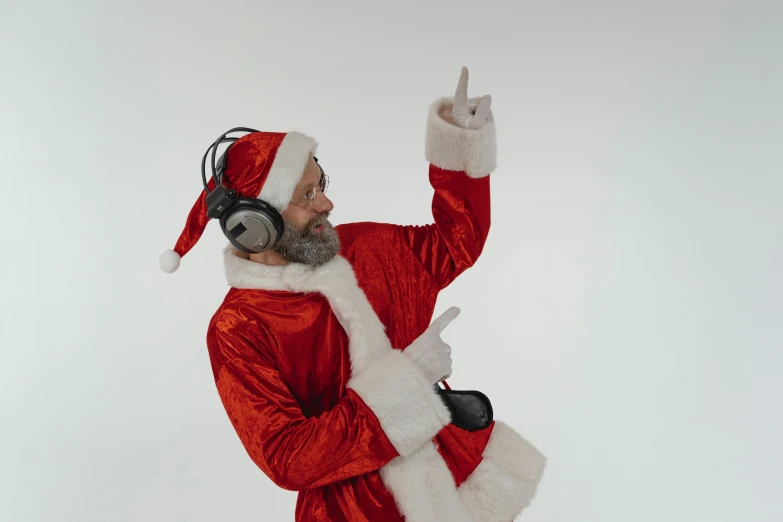 a man dressed in a santa suit and headphones, pexels, avatar image, various posed, max prentis, with index finger