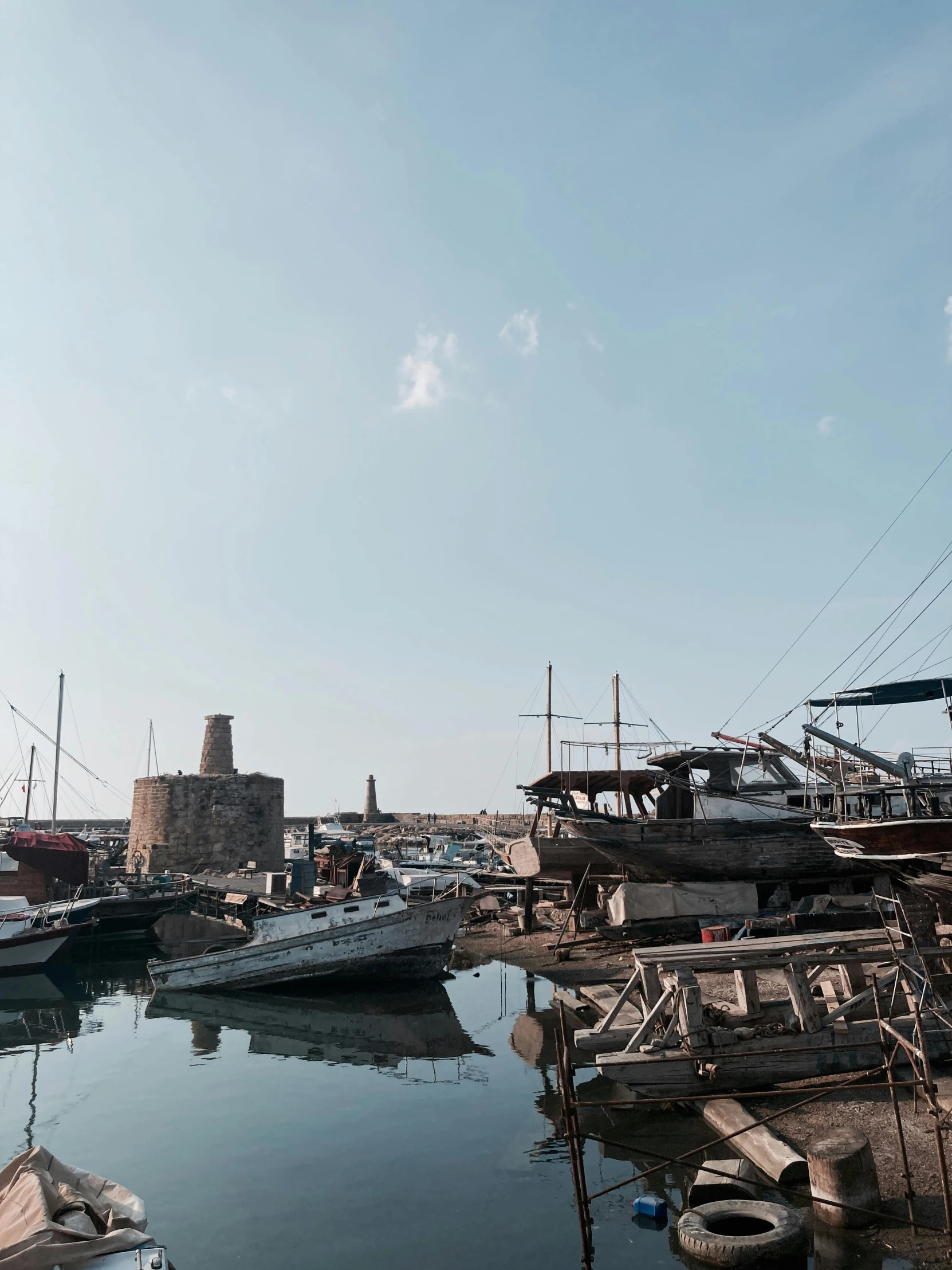 a number of boats in a body of water, byzantine ruins, today\'s featured photograph 4k, small port village, 😭 🤮 💕 🎀