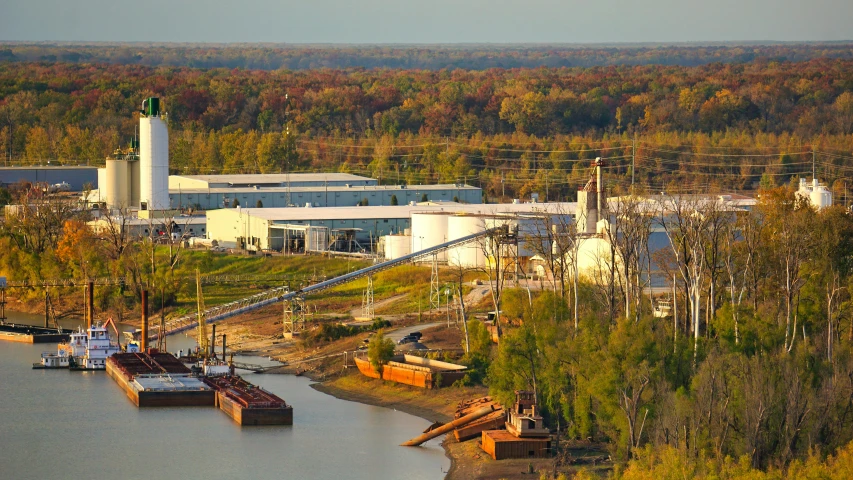 a large body of water next to a forest, industries, corporate memphis, thumbnail, brown