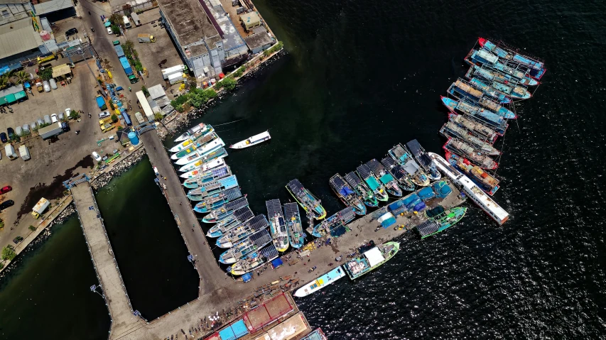 a group of boats sitting on top of a body of water, happening, satellite imagery, jakarta, boat dock, commercially ready