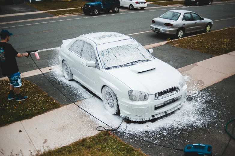 a man washing a white car on the side of the road, featured on reddit, auto-destructive art, wrx golf, avatar image, covered in white flour, photoscanned