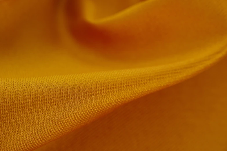 a close up of a yellow fabric, 8 k smooth, orange mist, dorne, material