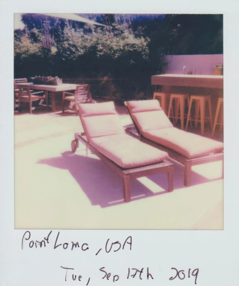 a polaroid picture of two lounge chairs on a patio, by Carey Morris, pop art, neil young, lê long, lonesome, paul kwon