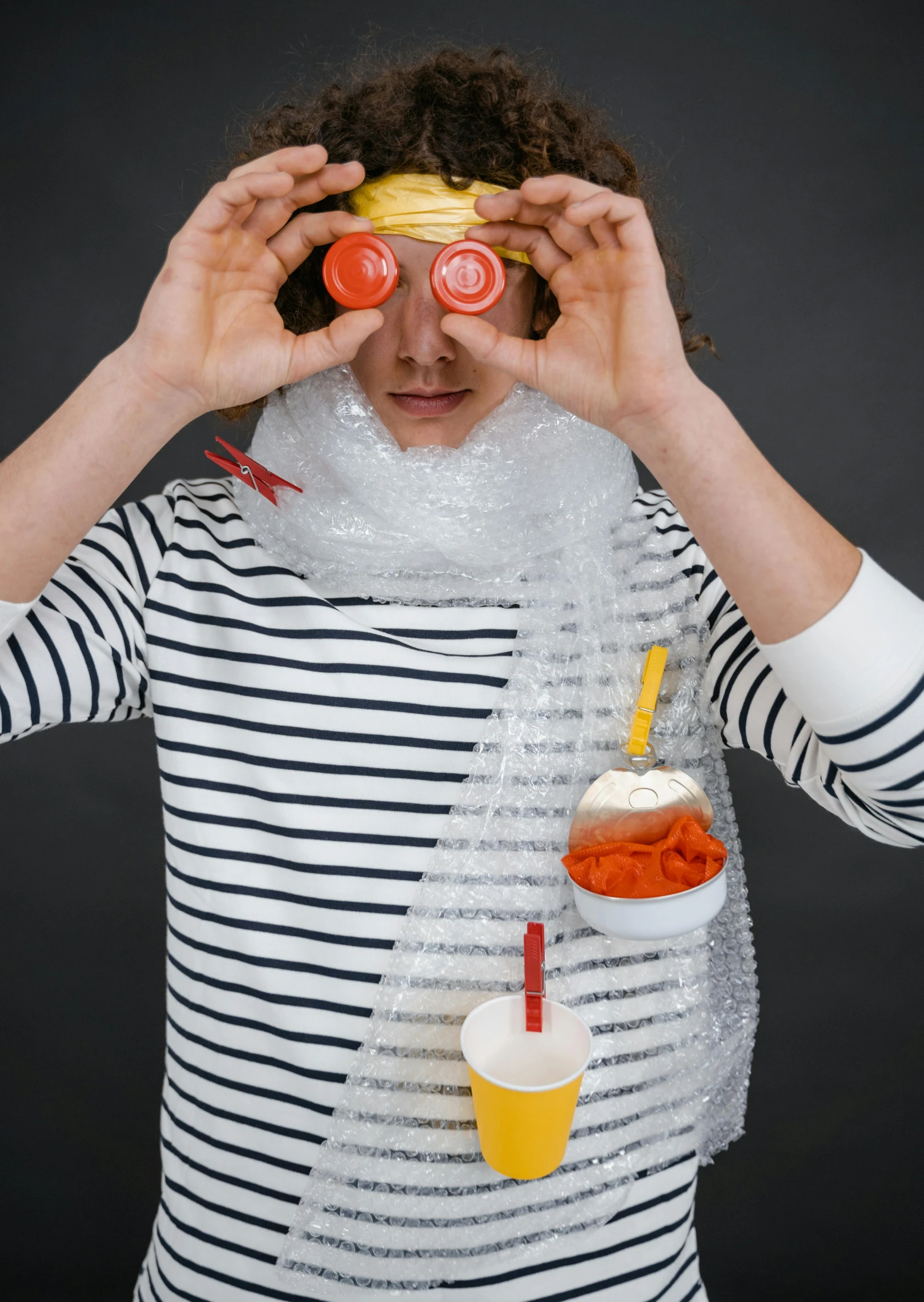 a man in a striped shirt covering his eyes with condiments, inspired by Sarah Lucas, trending on unsplash, plasticien, female made of ice, costume desig, hamburger mix jellyfish, scarf made from spaghetti