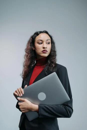 a woman in a business suit holding a laptop, pexels, renaissance, portrait sophie mudd, ashteroth, modern minimalist f 2 0, wearing a black sweater