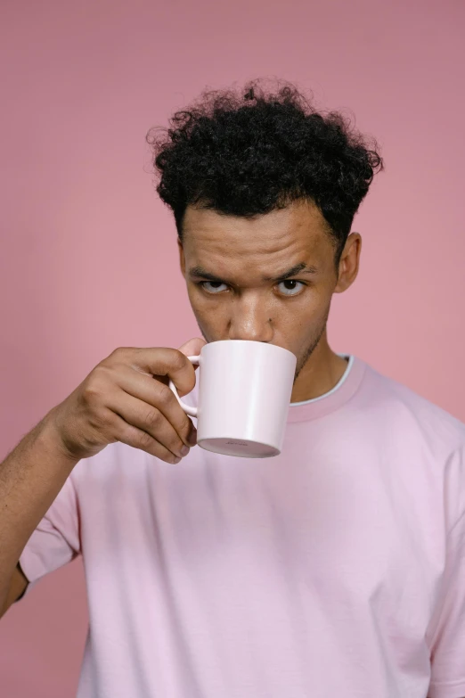 a man drinking out of a white cup, trending on pexels, renaissance, ((pink)), mixed race, blank stare”, non binary model