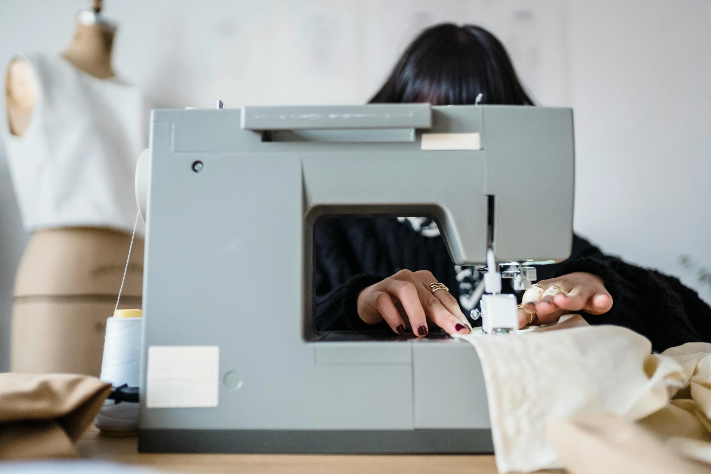 a woman is working on a sewing machine, by Nicolette Macnamara, profile image, fan favorite, uncrop, half image