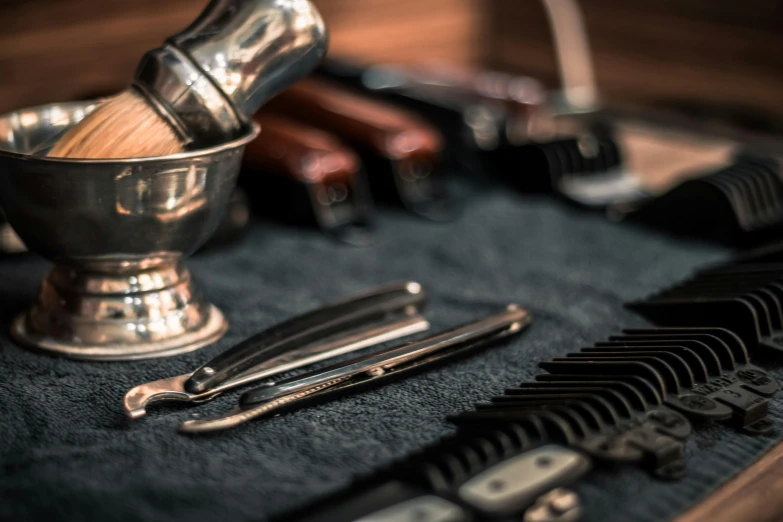 a bunch of tools sitting on top of a table, groomed beard, silver accessories, thumbnail, apothecary