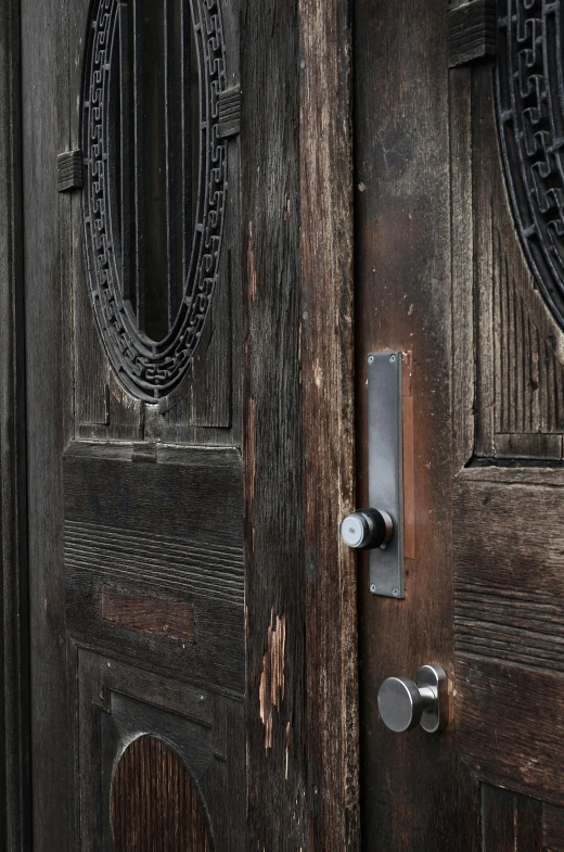 a couple of wooden doors sitting next to each other, by Sven Erixson, unsplash, high detail photograph, early 2 0 th century, dwell, closeup photograph