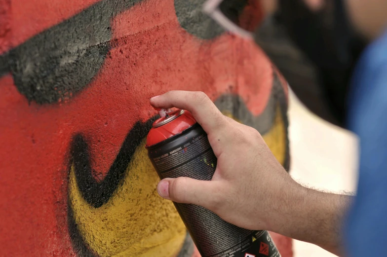 a person spray painting graffiti on a wall, it has a red and black paint, molotow premium color palette, hyperdetailed!, can of paint