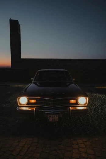 a car parked in a parking lot at night, an album cover, pexels contest winner, hypermodernism, back light, square, tourist photo, profile image
