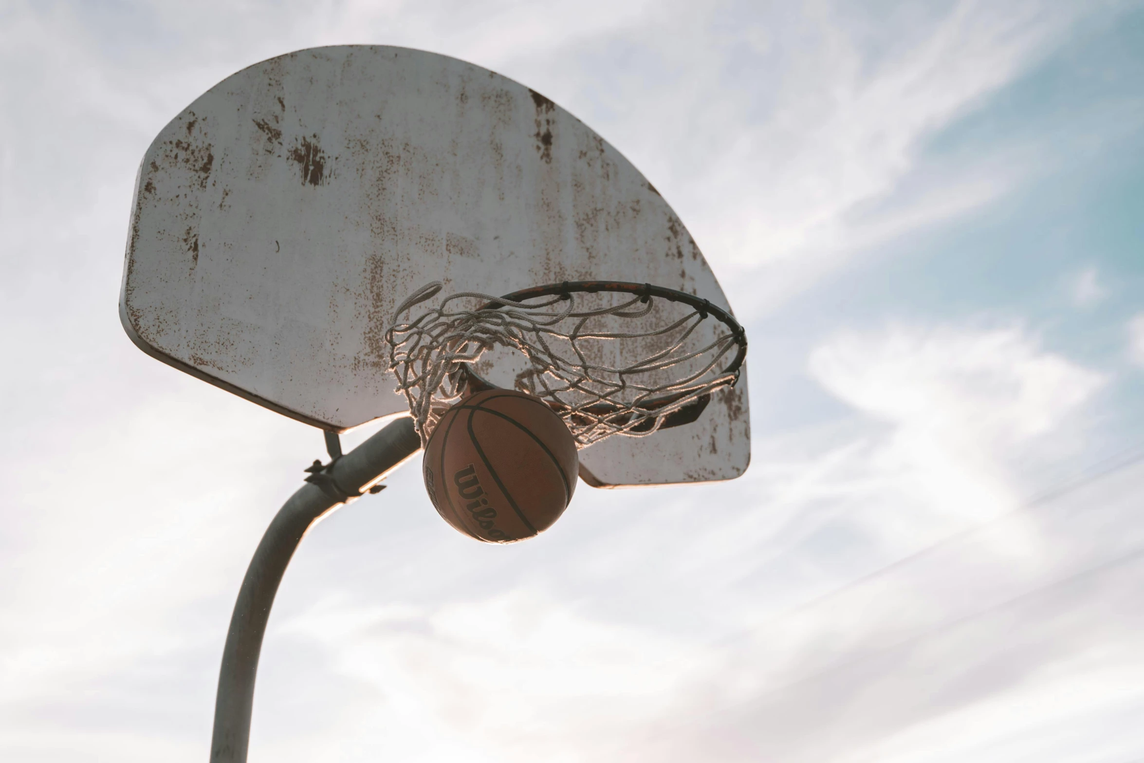 a basketball hoop with a basketball inside of it, pexels contest winner, golden hour cinematic, 15081959 21121991 01012000 4k, instagram post, slight overcast weather