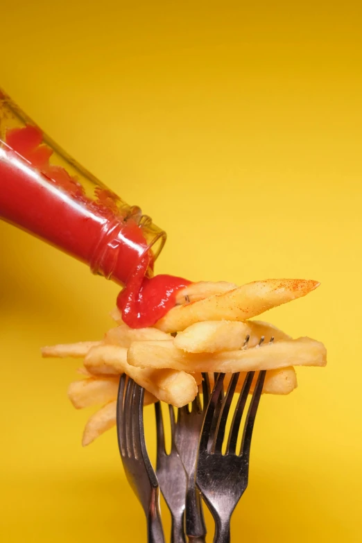 a fork with french fries and ketchup on it, inspired by Heinz Anger, pexels, photorealism, pouring, mustard, gif, fireball