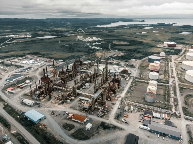 an aerial view of a large oil refinery, a portrait, pexels contest winner, quebec, high quality picture, ground level shot, thumbnail