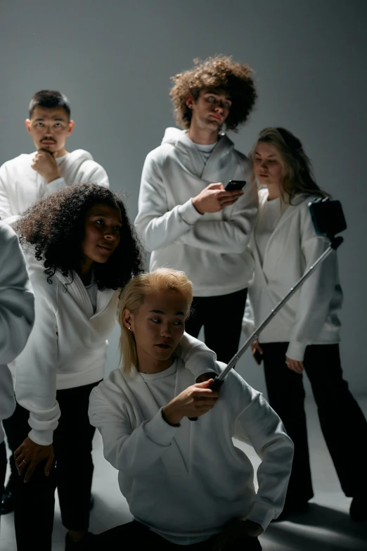 a group of people standing next to each other, trending on pexels, antipodeans, wearing a white sweater, 2 techwear women, commercial, teenagers