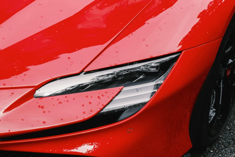 a red sports car parked in a parking lot, pexels contest winner, photorealism, headlight washer, avatar image, tesla, ultra - details