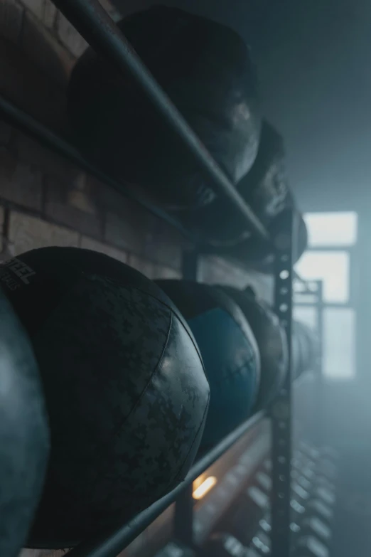 a bunch of balls sitting on top of a shelf, cinematic keyframe, athletic crossfit build, smoke filled room, instagram post