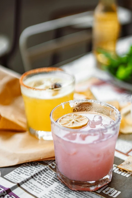 a couple of drinks sitting on top of a table, daily specials, mexican, square, pink