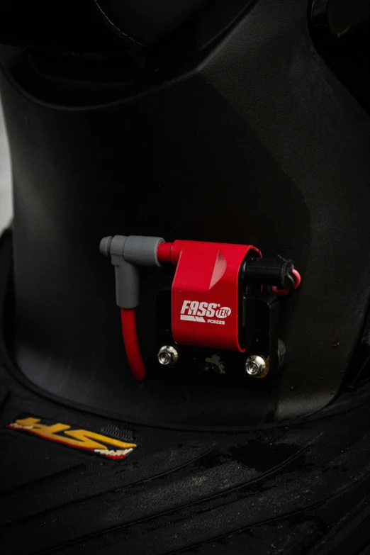 a close up of a helmet on a mannequin, starting engines nitro jet drive, red wires wrap around, fess, detail shot